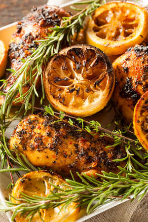 Homemade Lemon and Herb Chicken with Salad and Asparagusの写真素材