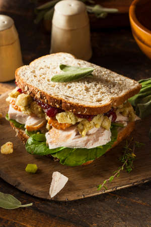 Homemade Leftover Thanksgiving Dinner Turkey Sandwich with Cranberries and Stuffingの写真素材