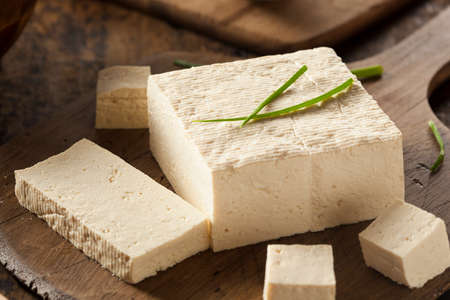 Organic Raw Soy Tofu on a Backgroundの写真素材