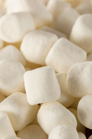 Unhealthy White Mini Marshmallows in a Bowlの写真素材
