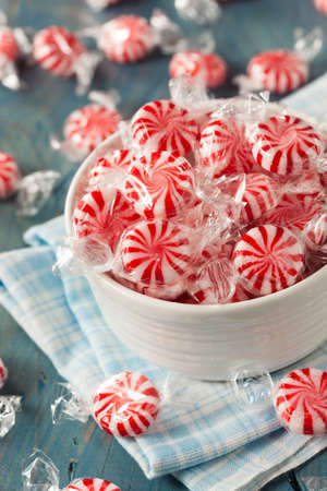 Sweet Red and White Peppermint Candy in a Bowlの写真素材