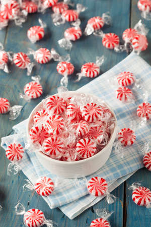 Sweet Red and White Peppermint Candy in a Bowlの写真素材