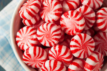 Sweet Red and White Peppermint Candy in a Bowlの写真素材