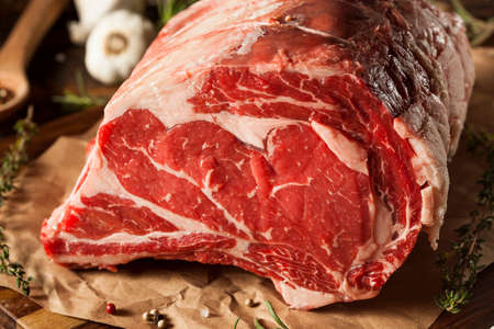 Raw Grass Fed Prime Rib Meat with Herbs and Spicesの写真素材