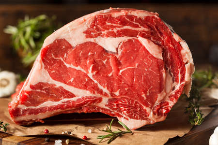 Raw Grass Fed Prime Rib Meat with Herbs and Spicesの写真素材
