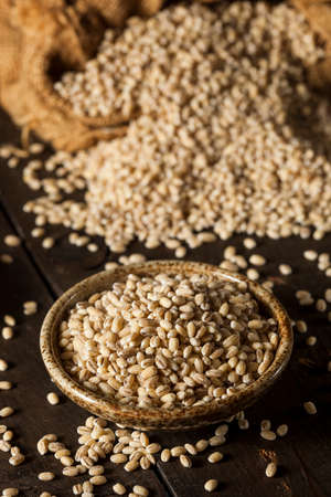 Raw Organic Barley Grain on a Backgroundの写真素材