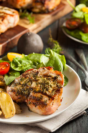 Large Grilled Pork Chop with Basil Lemon Seasoningsの写真素材