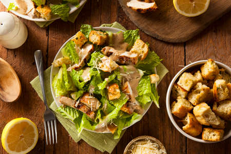 Healthy Grilled Chicken Caesar Salad with Cheese and Croutonsの写真素材