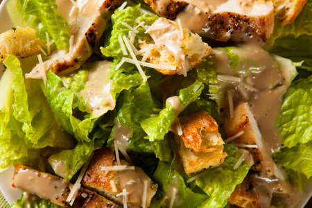 Healthy Grilled Chicken Caesar Salad with Cheese and Croutonsの写真素材
