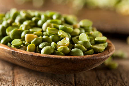 Raw Organic Green Split Peas in a Spoon