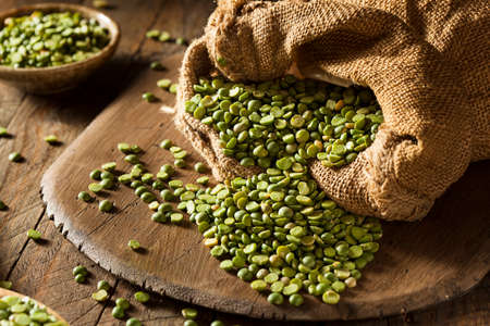 Raw Organic Green Split Peas in a Spoon
