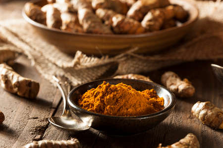 Raw Organic Turmeric Spice in a Bowlの写真素材