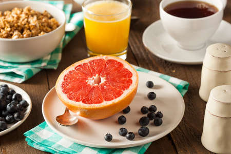 Healthy Organic Grapefruit for Breakfast with Coffee and Juiceの写真素材