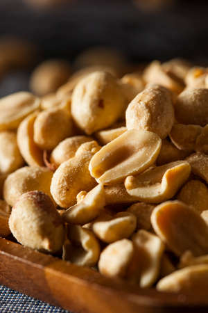 Organic Roasted Salty Peanuts in a Bowlの写真素材