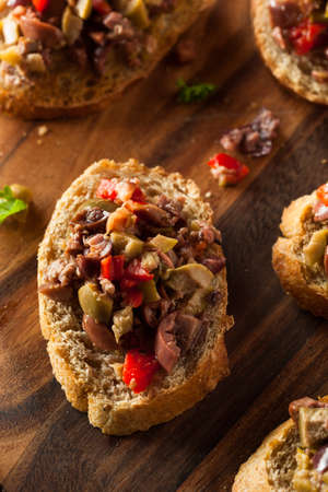 Homemade Mixed Olive Tapenade on Whole Wheat Crostiniの写真素材