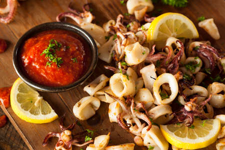 Homemade Fresh Grilled Calamari with Lemon and Sauceの写真素材