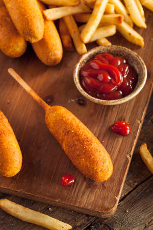Homemade Organic Corn Dogs with Fries and Ketchupの写真素材