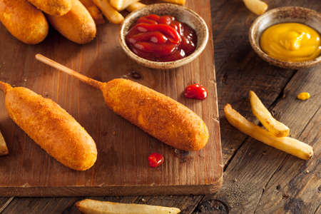 Homemade Organic Corn Dogs with Fries and Ketchupの写真素材