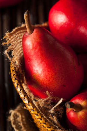 Raw Organic Red Pears in a Basketの写真素材