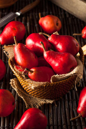 Raw Organic Red Pears in a Basketの写真素材