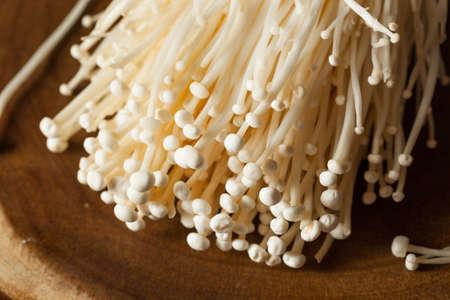 Raw Organic Enoki Mushrooms in a Bunchingの写真素材