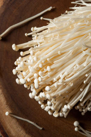 Raw Organic Enoki Mushrooms in a Bunchingの写真素材