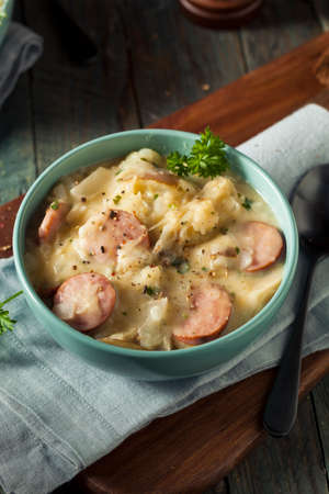 Homemade Sauerkraut and Sausage Soup with Potatoes and Parsleyの写真素材