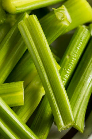 Raw Organic Green Celery Stalks with Ranch Dipの写真素材