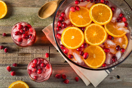 Red Cranberry Holiday Punch with Orange Slicesの写真素材