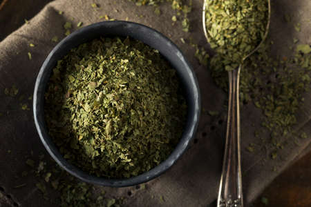 Raw Organic Dry Green Cilantro in a Bowl