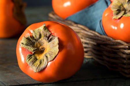 Raw Organic Orange Perssimons Ready to Eatの写真素材