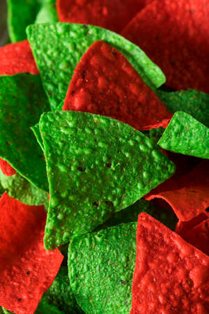 Festive Christmas Green and Red Tortilla Chips with Salsaの写真素材