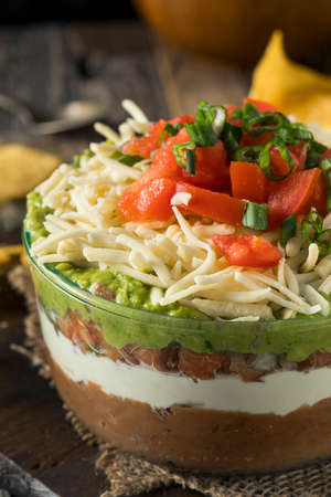 Homemade Mexican 7 Layer Dip with Beans, Sour Cream and Guacamoleの写真素材