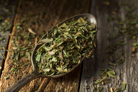 Raw Organic Dry Tarragon Spice in a Bowlの写真素材