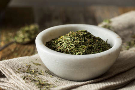 Raw Organic Dry Tarragon Spice in a Bowlの写真素材