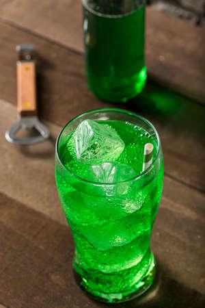 Refreshing Green Lime Soda Pop in an Iced Glassの写真素材