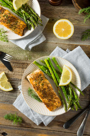 Organic Pan Seared Salmon with Lemon and Asparagusの写真素材