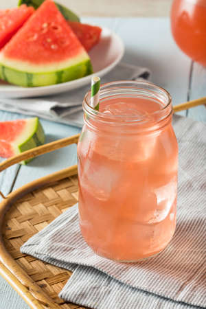 Refreshing Cold Watermelon Juice with Ice and a Strawの写真素材