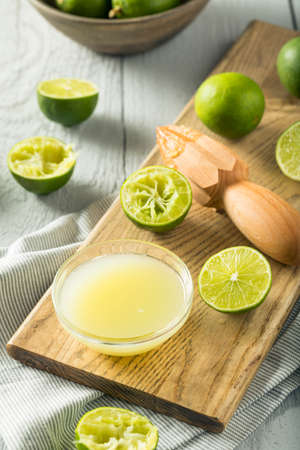 Raw Organic Yellow Lime Juice in a Bowlの写真素材