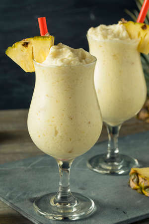Homemade Frozen Pina Colada Cocktail with a Pineapple Garnishの写真素材