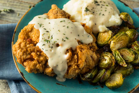 Homemade Country Fried Steak with Gravy and Potatoesの写真素材