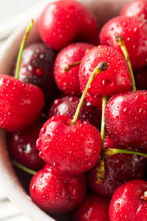Raw Organic Red Sweet Cherries in a Bowlの写真素材