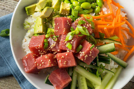 Raw Organic Ahi Tuna Poke Bowl with Rice and Veggiesの写真素材