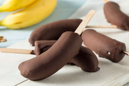Homemade Frozen Chocolate Covered Bananas on a Stickの写真素材