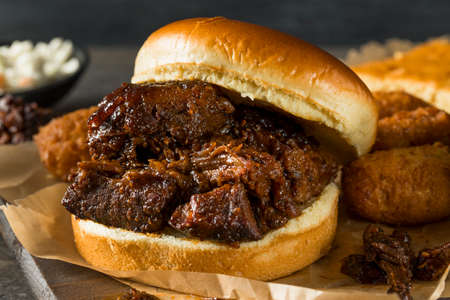 Slow Smoked Brisket Burnt Ends Sandwich with Sidesの写真素材