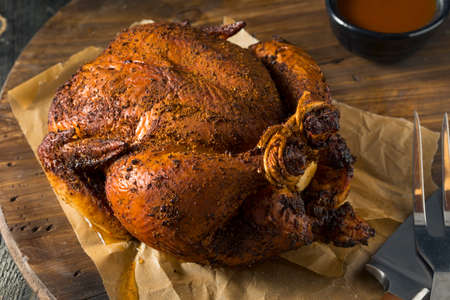 Homemade Barbecue Smoked Chicken Ready to Carveの写真素材