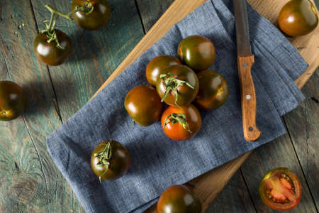 Raw Organic Brown Kumato Tomatoes Ready to Eatの写真素材