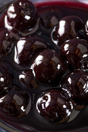 Fancy Dark Maraschino Cocktail Cherries in a Bowlの写真素材