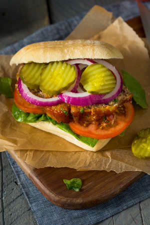 Homemade Savory Meatloaf Sandwich with Lettuce and Tomatoの写真素材