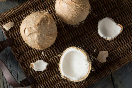 Raw Organic White Hairy Coconuts Cracked Open